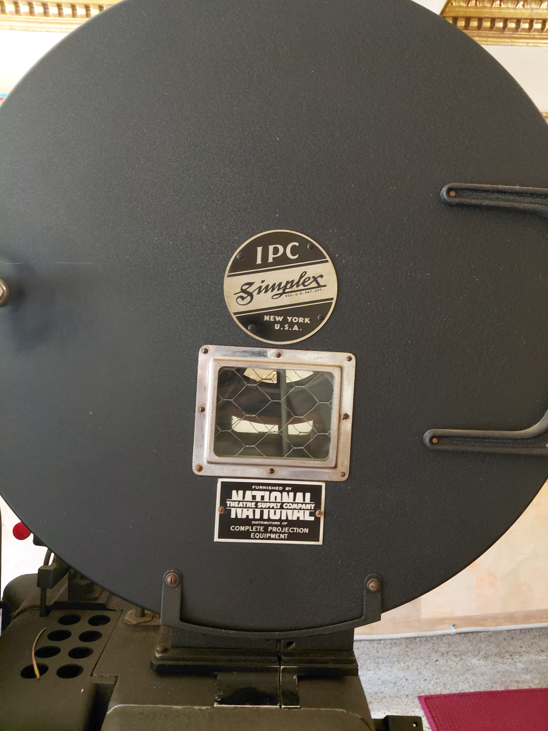 International Projector Corporation identification plate on the Simplex X-L projector