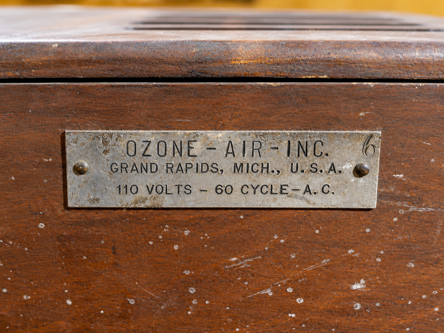 Identification plate on vintage ozone generator reading Ozone-Air Inc., Grand Rapids, Michigan