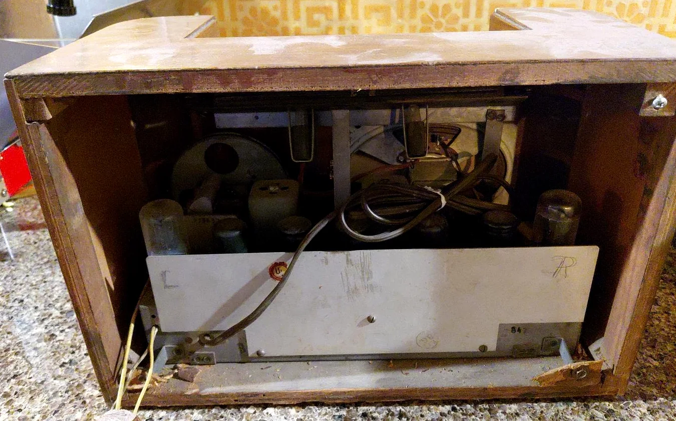 Interior of vintage TruTone radio showing speaker, vacuum-tube chassis and wiring